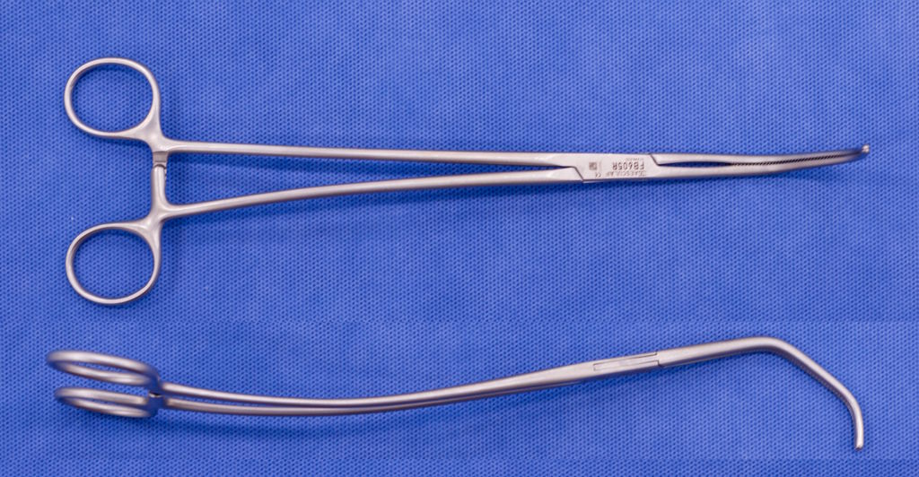 Forceps on blue background Forceps on blue background