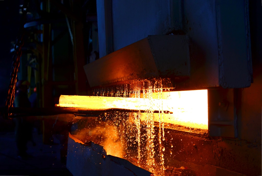 Steel quenching at high temperature in an industrial furnace Steel quenching at high temperature in an industrial furnace