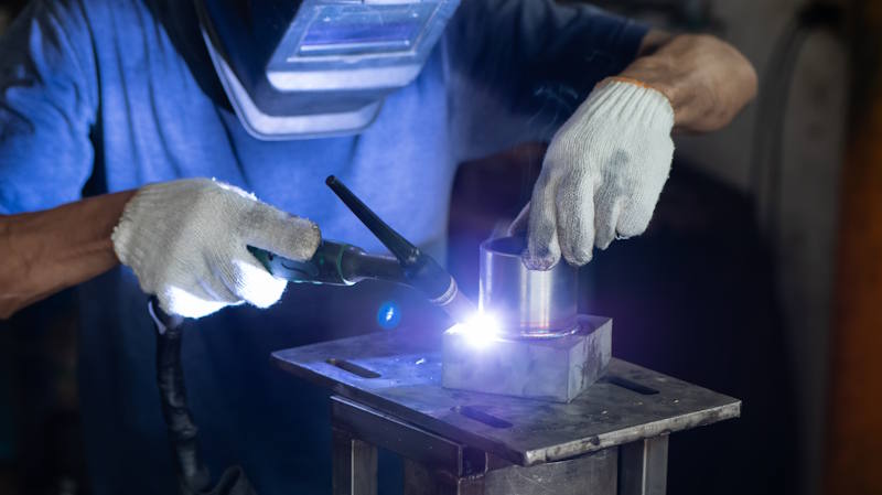 man welding metal
